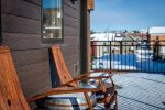 The whiskey barrel-inspired patio set provides a comfortable place to take in the incredible mountain views.